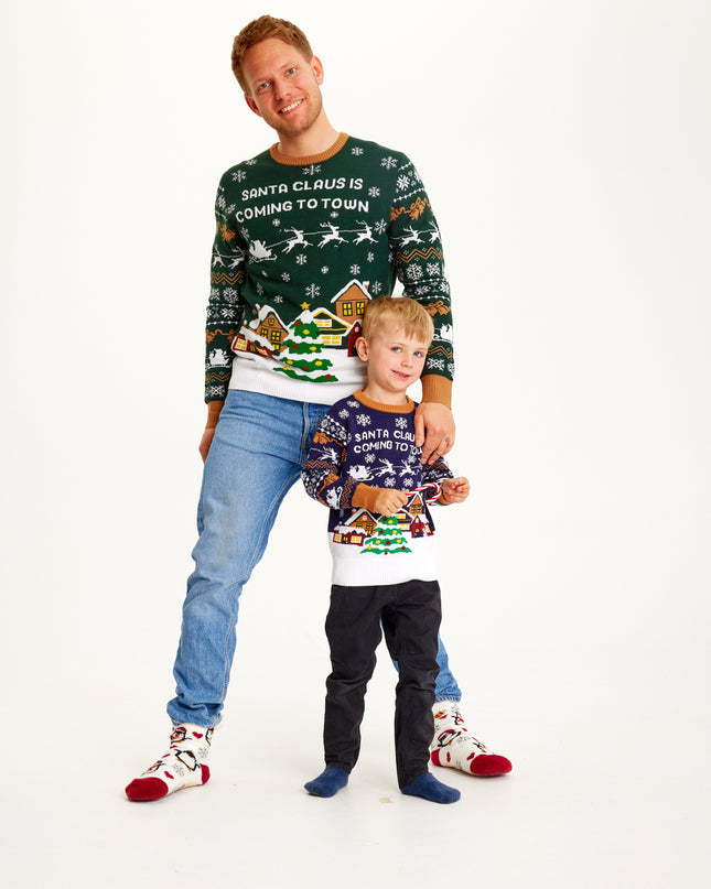 Le Père Noël arrive en ville - Pull bleu marine pour enfants