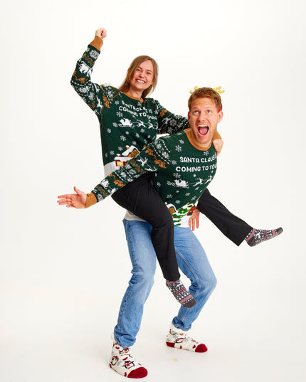 Le Père Noël arrive en ville ! Pull vert LED pour homme